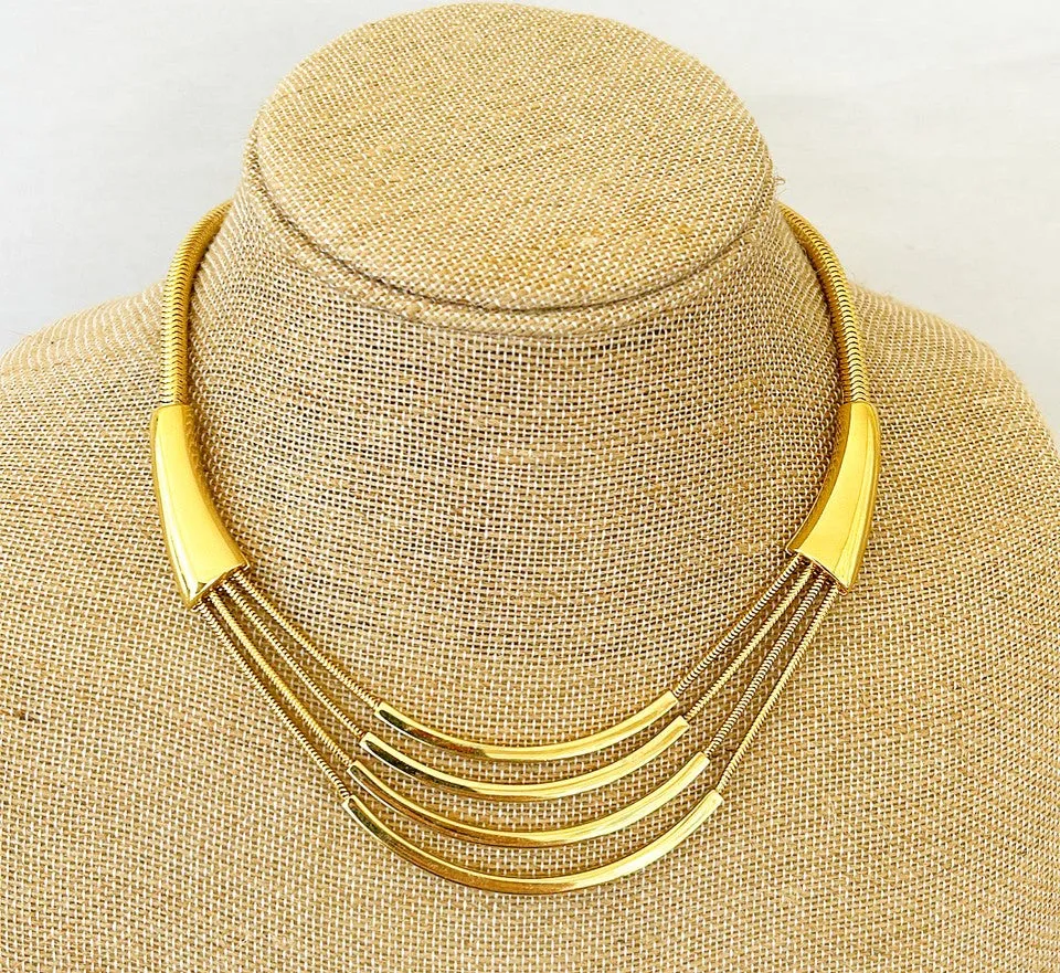 1970s vintage signed MONET designer necklace in a gold tone metal finish