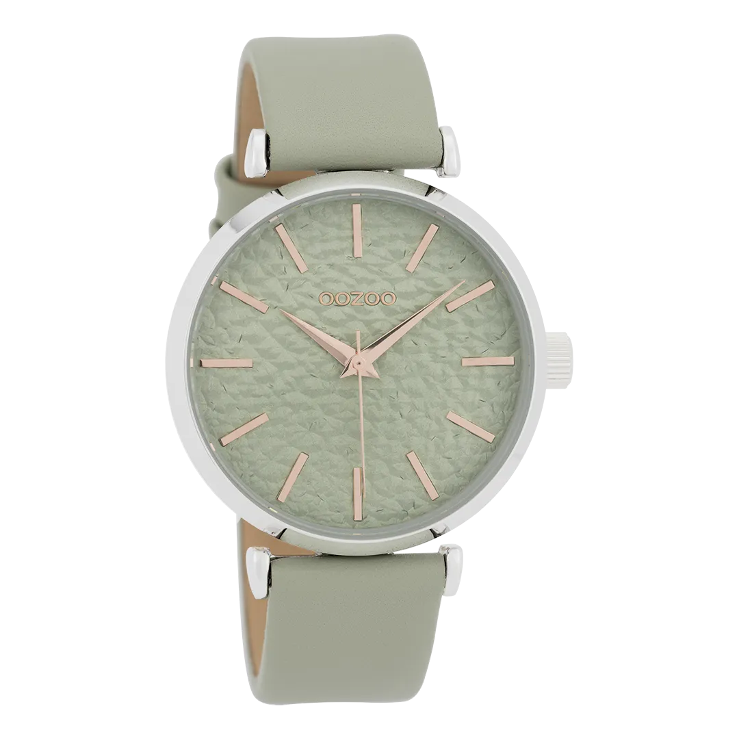 Silver coloured  watch with green grey  leather strap